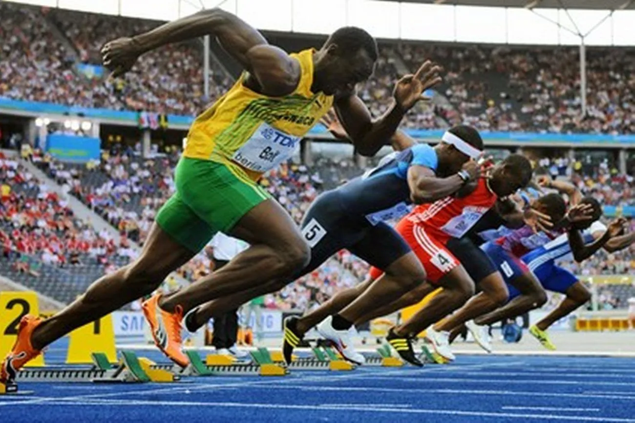 Premier performance and athletics: Professional athletes running in a stadium, showcasing peak athleticism and high-level competition