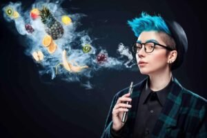 E-Liquids Outlet UK Vape Shop banner featuring vape devices and e-liquid bottles with a smoky purple background.