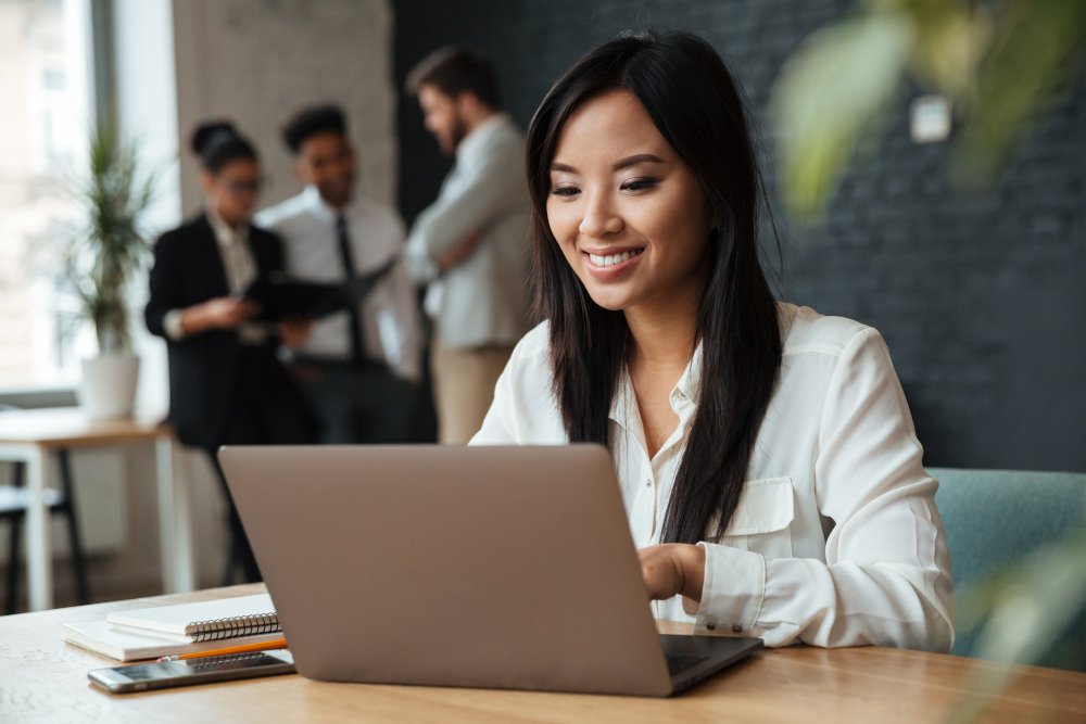 An entrepreneur checks on their business online.